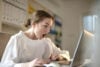 Woman surprised at laptop - NBN deal