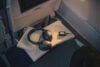 JBL Tour One M3 Smart TX headphones on a plane