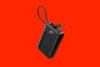 Anker a1647 power bank on red background