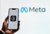 Meta logo with Threads app on phone