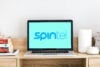SpinTel logo on a laptop