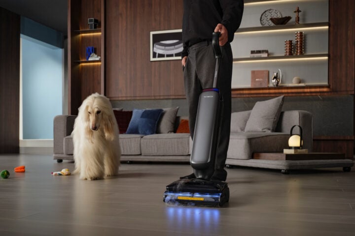 Tineco Floor One S9 Artist Steam being used in a dark room with a dog