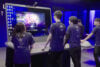 Members of Team liquid playing League of Legends on the world's biggest laptop
