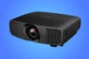 Epson EH-LS9000B projector on blue gradient background
