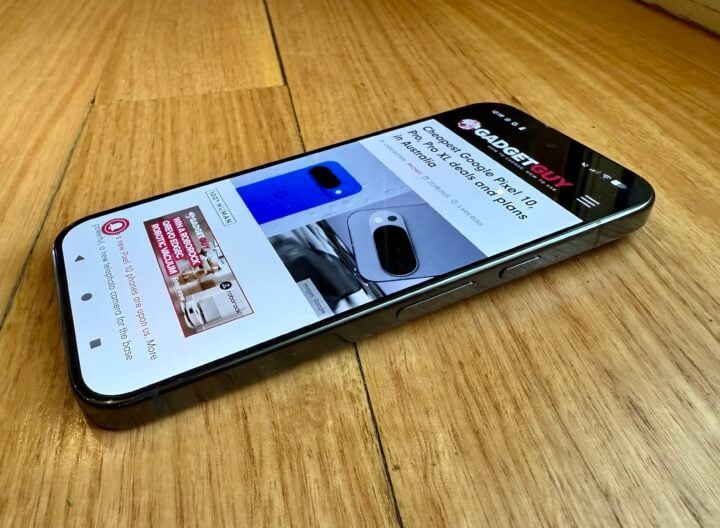 Google Pixel 10 Pro screen facing up on wooden surface