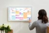 Skylight Calendar Max woman touching the screen