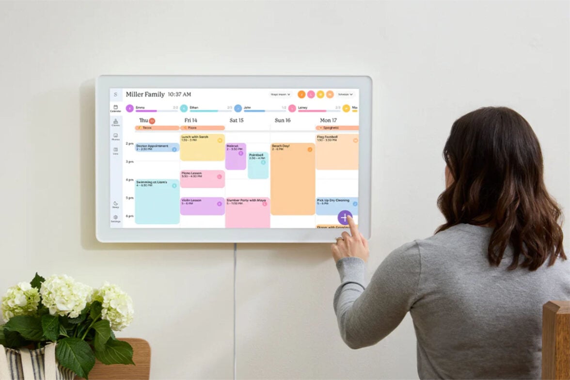 Skylight Calendar Max woman touching the screen