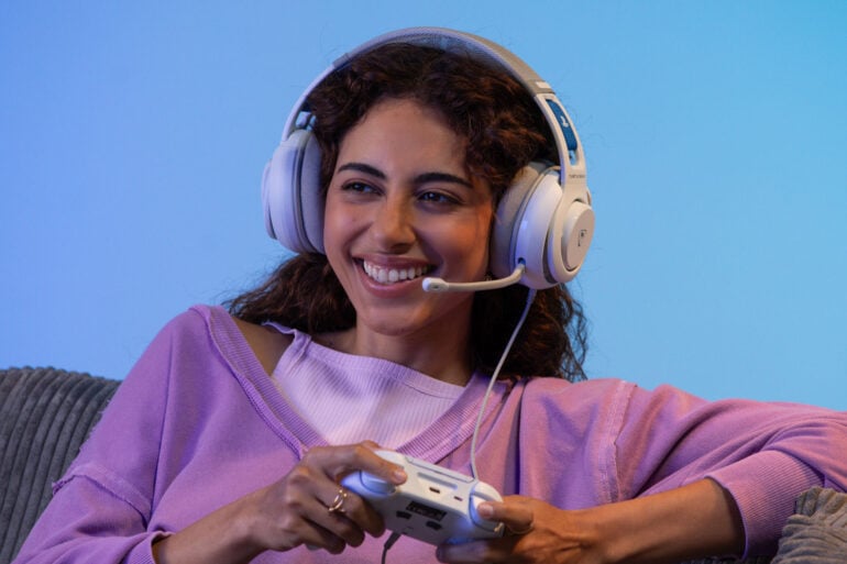 Turtle Beach Atlas 200 PlayStation headset woman with a controller