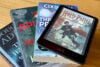 Kindle Colorsoft Signature Edition on a pile of books