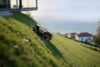 Roborock RockMow Z1 climbing a grassy hill