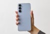 Samsung Galaxy S25 FE light blue in hand