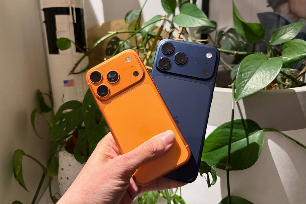 iPhone 17 Pro Max orange and blue in hand