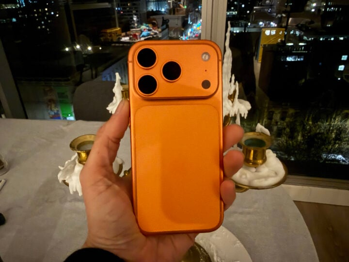 iPhone 17 Pro Max orange in front of table