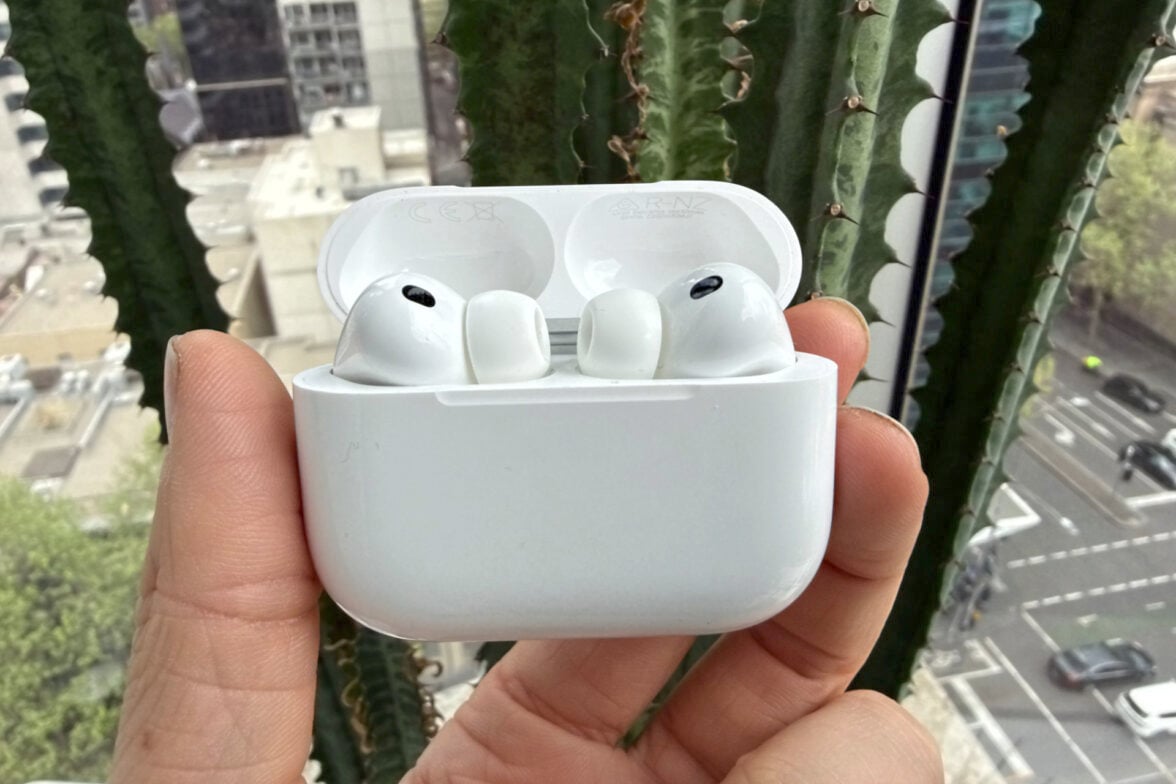 Apple AirPods Pro 3 in case held in hand