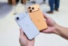 Hands holding iPhone Air and iPhone Pro