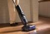 Roborock F25 Ultra wet-dry vacuum cleaning up spill