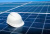 White hard hat on solar panels