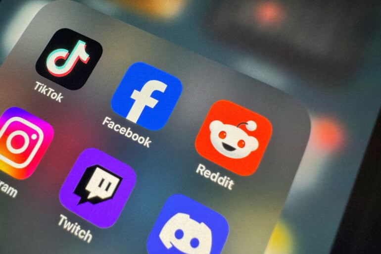 Reddit app icon on phone