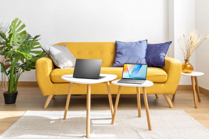 Asus Vivobook S16 laptops bright yellow couch