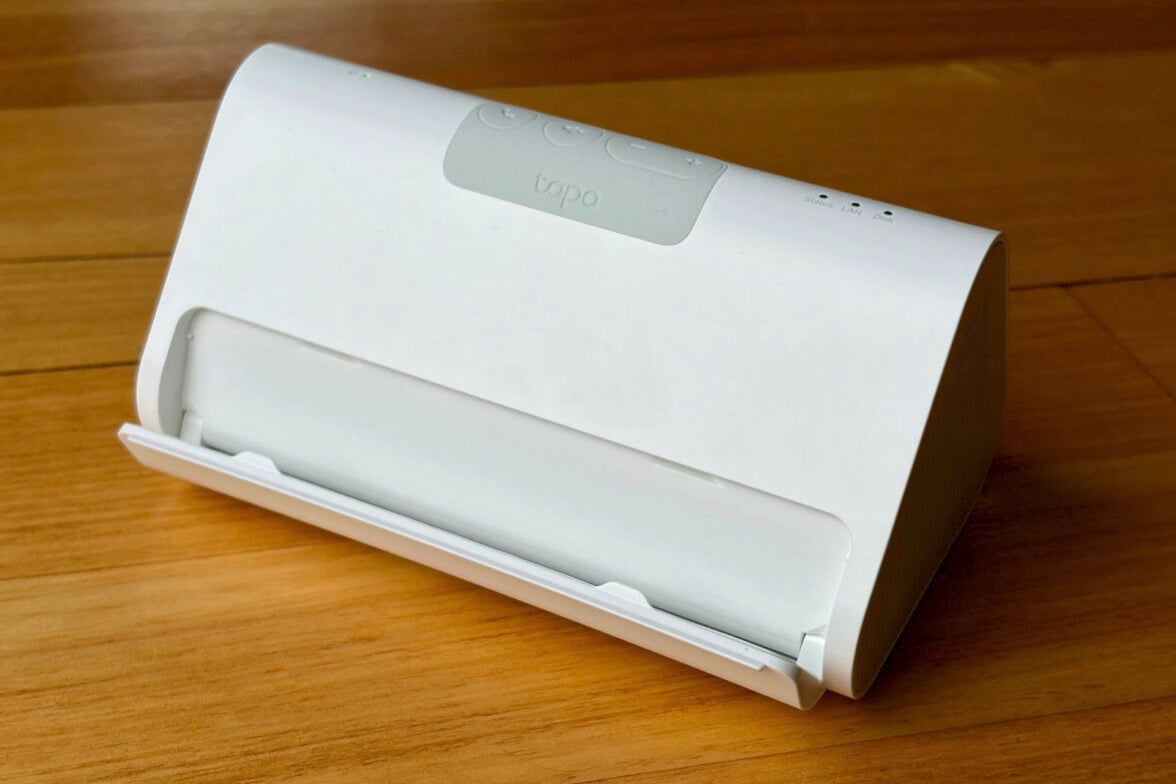 Tapo H500 Smart HomeBase on wood surface