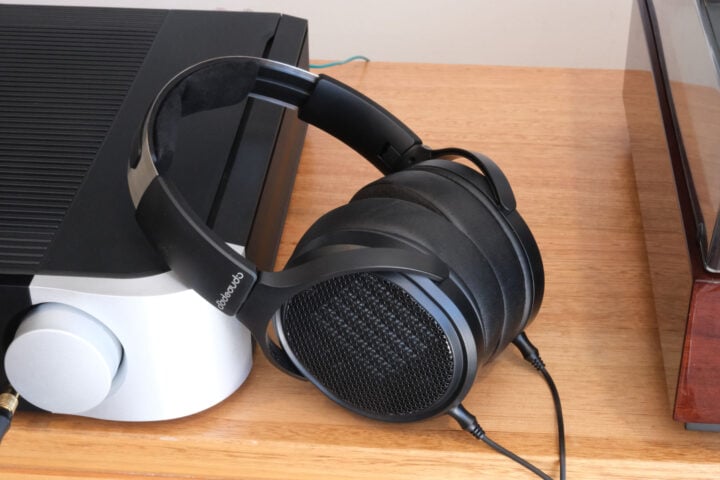 FiiO JT7 headphones leaning on audio system