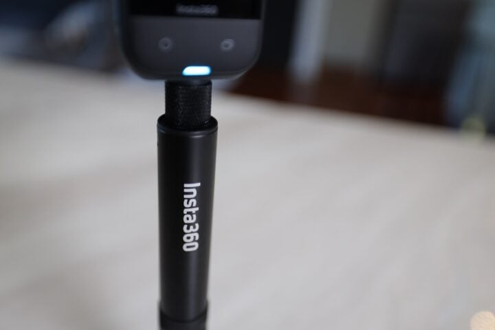 Insta360 selfie stick close up showing logo