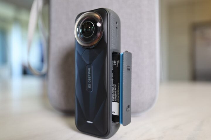 Insta360 X5 showing battery partly inserted