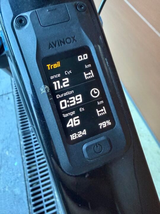Close up of OLED screen showing riding stats