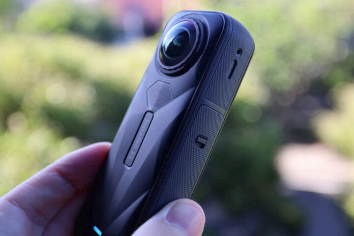 Insta360 X5 in hand close up