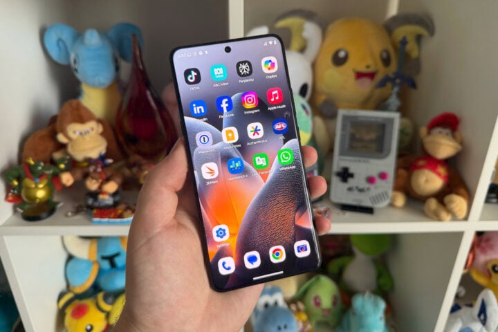 Motorola Signature held in front of shelves