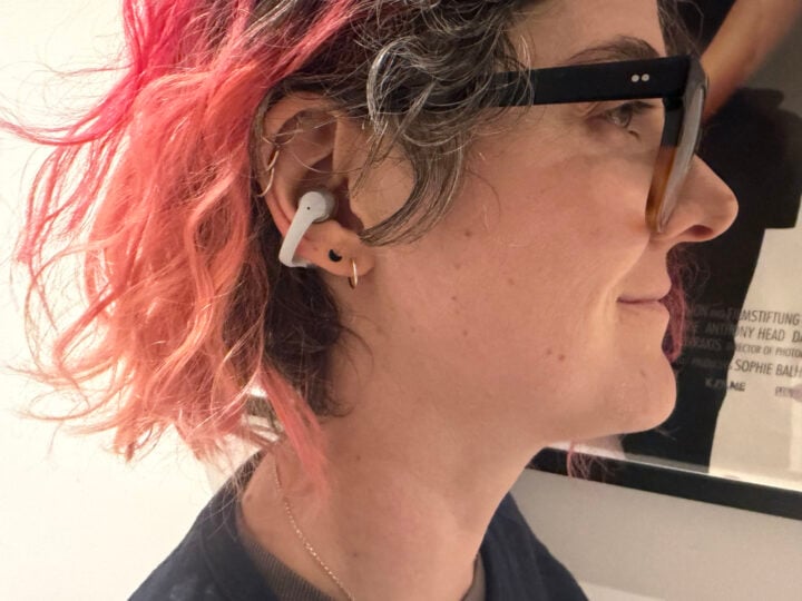Alice wearing Shokz OpenDots Air earbuds