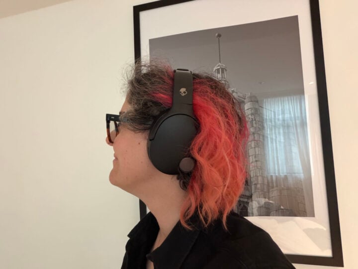 Alice wearing black Skullcandy Crusher 1080 ANC headphones