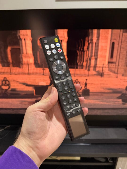 Hisense solar remote held in hand