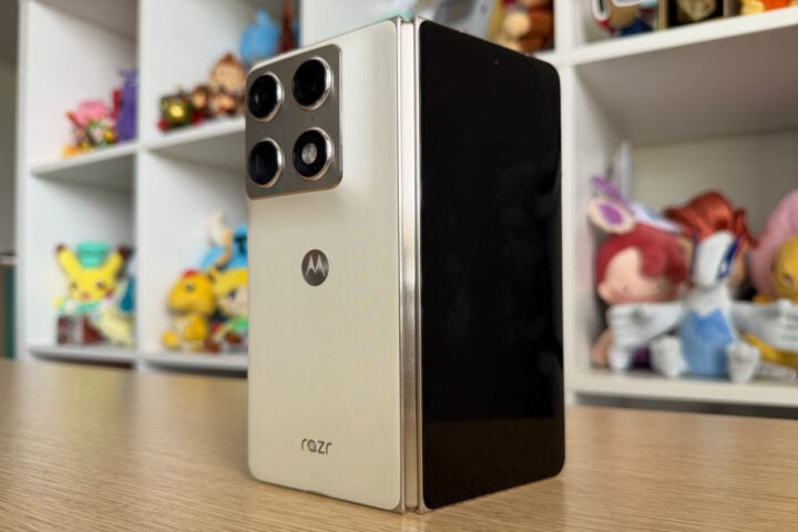 Motorola Razr Fold standing upright on wooden desk