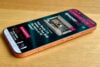 Orange Honor 600 Pro phone on wooden desk
