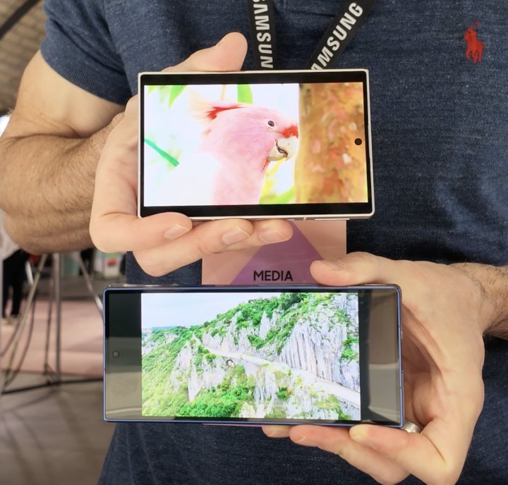 Galaxy Z Fold8 and Galaxy Z Fold8 Ultra shown one on top of the other with full screen video playing on outer screens. 