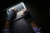 Anonymous person typing on laptop stock image