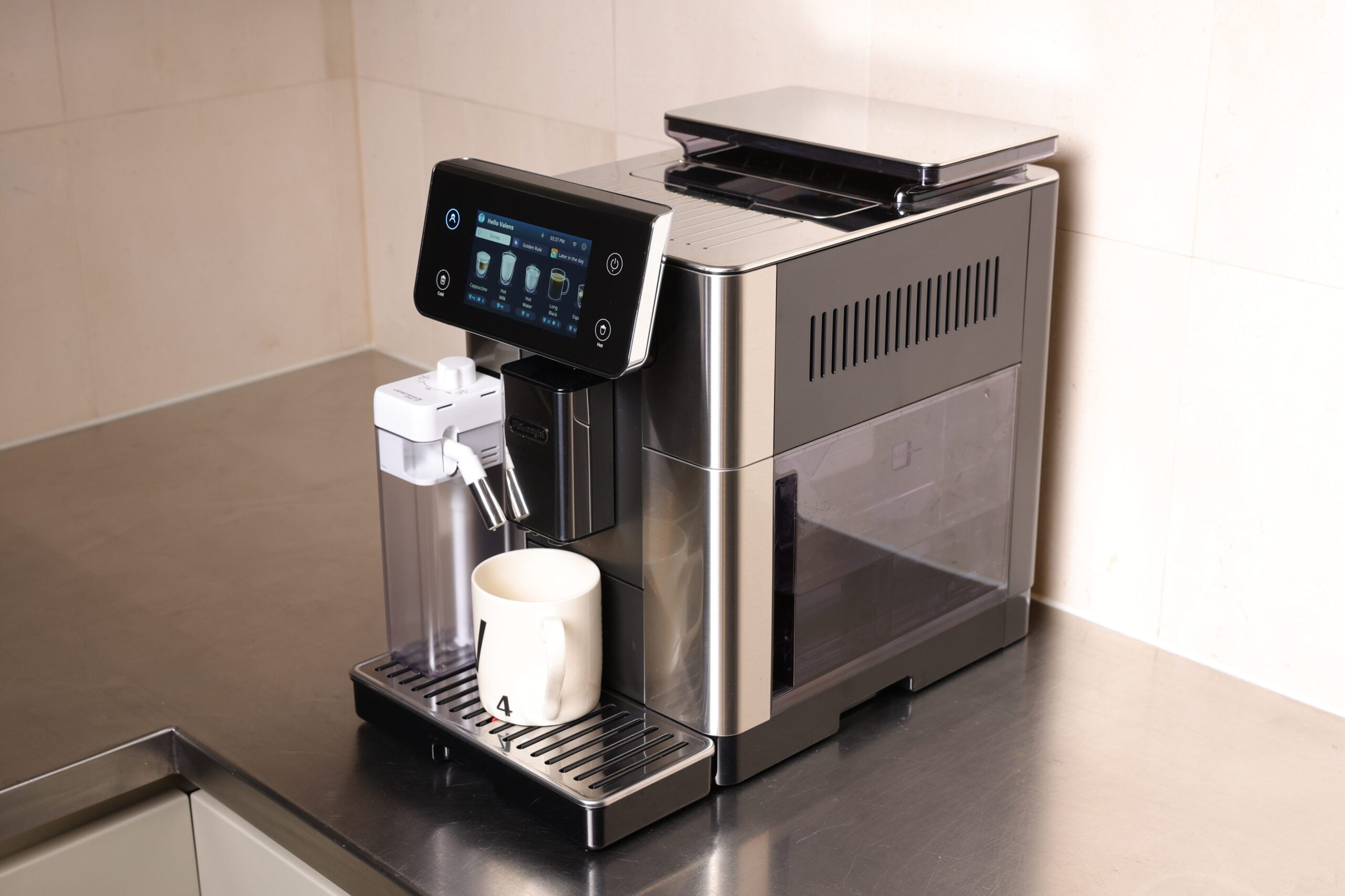  De'Longhi PrimaDonna on stainless steel countertop with cold-milk frother