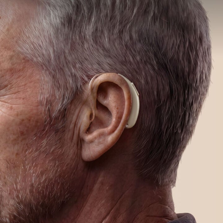 Close up of man wearing Anker RIC Hearing Aids Pro