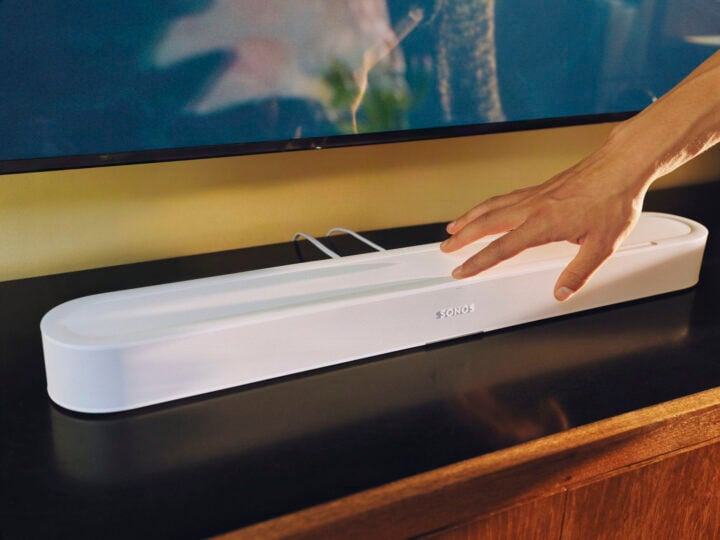 Hand pressing Sonos Beam Ultra
