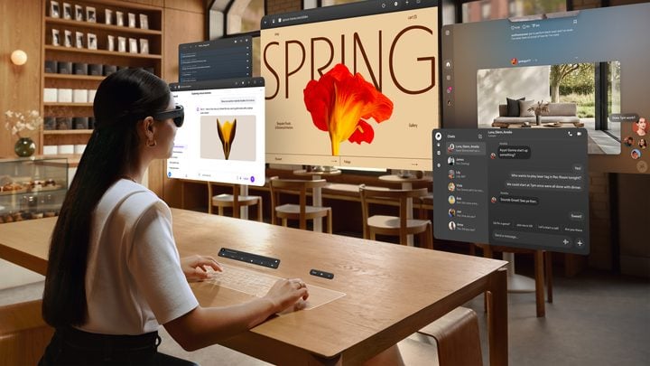 person using virtual screens and keyboard and trackpad