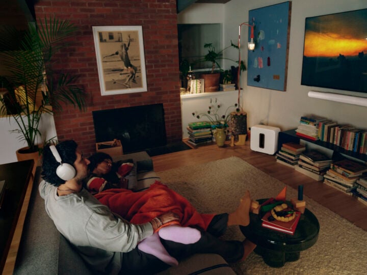 Person watching TV using Sonos Ace Ultra