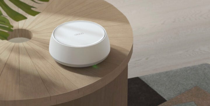 TP-Link Deco 7 router on wooden table