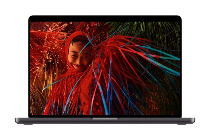 MacBook Pro with PROLED XDR Display showing a vivid red and blue portrait photo