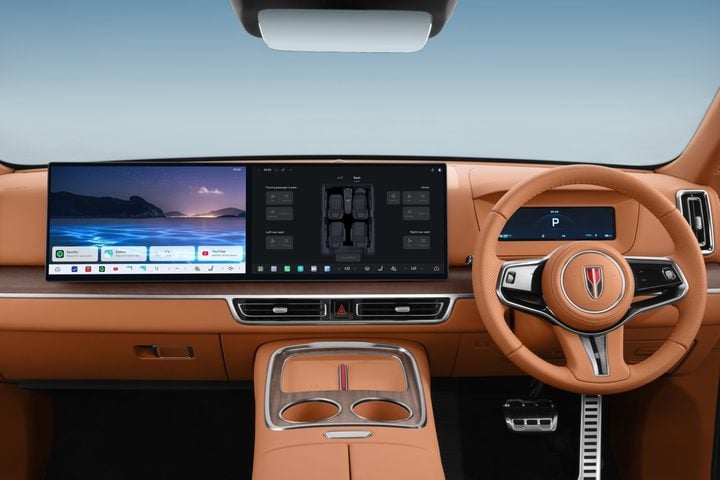 Right-hand-drive dashboard of the HongQi E-HS9 with a wide panoramic display and tan leather trim