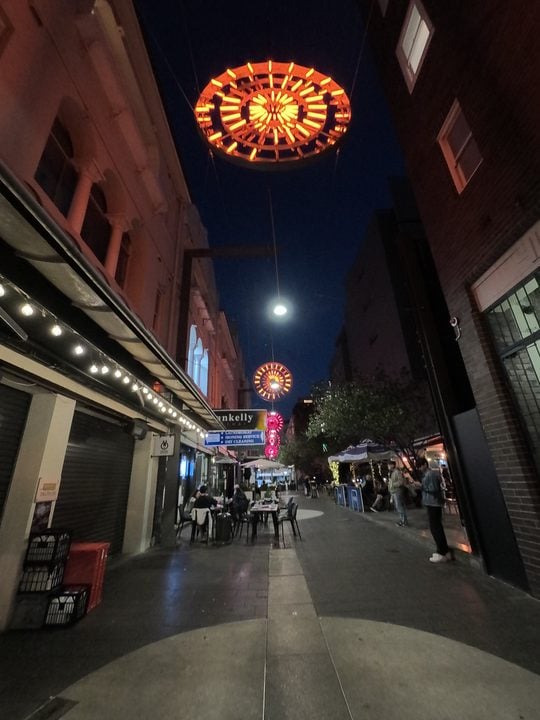 Shot of street with signage in low light