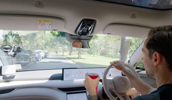 GoPro Mission 1 Pro mounted on the windscreen inside a car