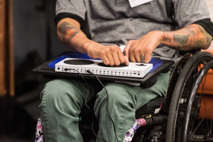Person in wheelchair using Xbox Adaptive Controller