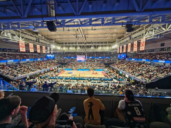 Ultrawide photo of a full basketball stadium
