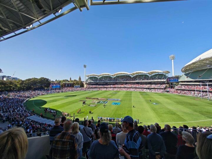 Ultrawide photo of a footy stadium during daytime